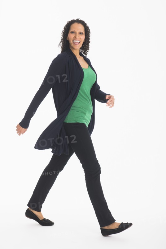 Studio shot of woman walking.