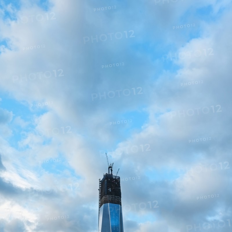 Construction site and cloudy sky.