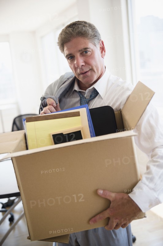 Office worker with packed carton box. Photo: Jamie Grill