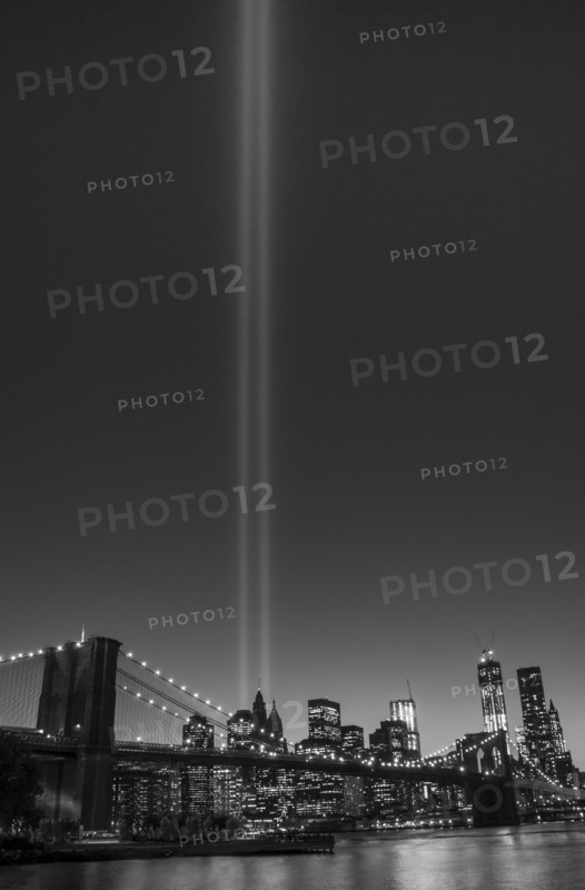 View over Hudson River towards Manhattan with September 11th memorial lights and Brooklyn Bridge. Photo: Daniel Grill