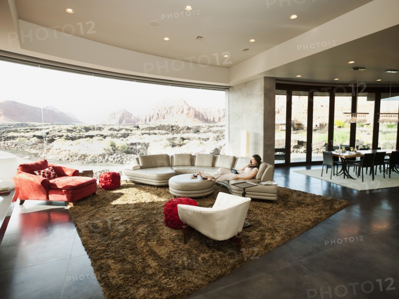 Young woman relaxing in her living room. Photo: Erik Isakson