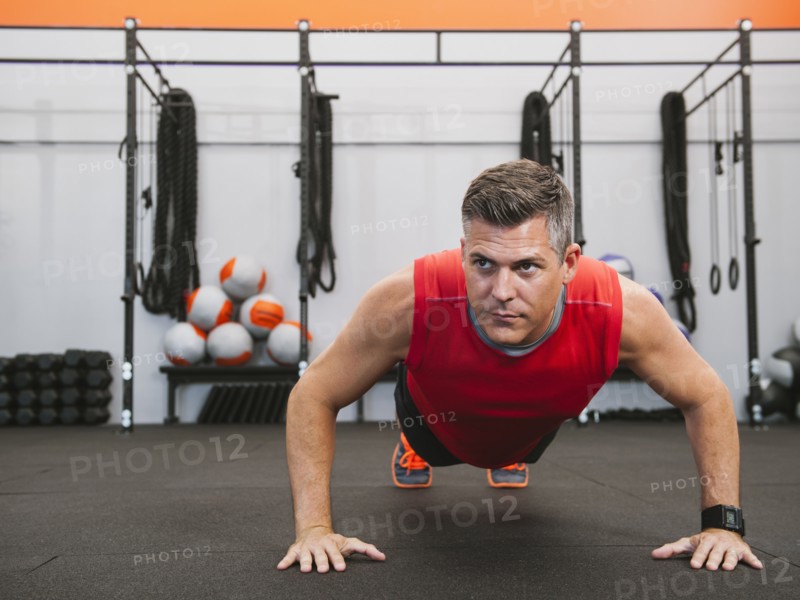 Mature man doing push-ups.