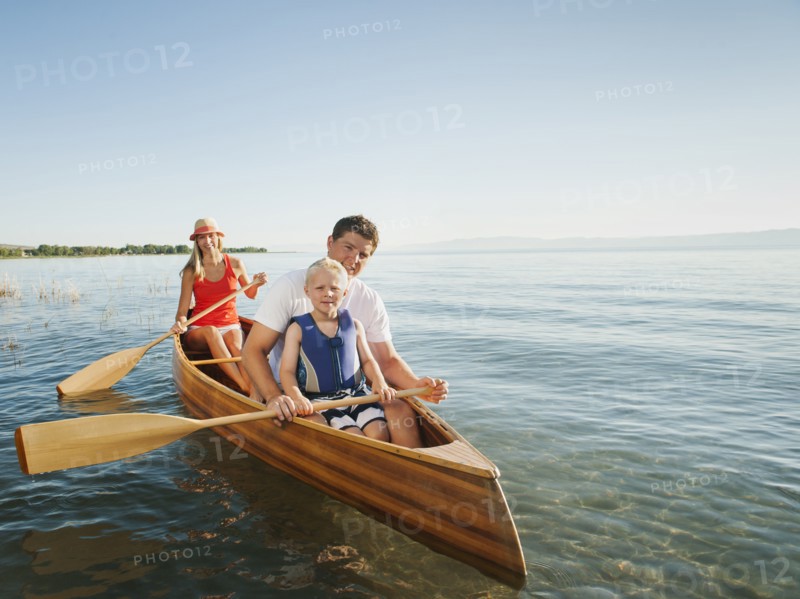 Portrait of family with son (4-5) canoe traveling.