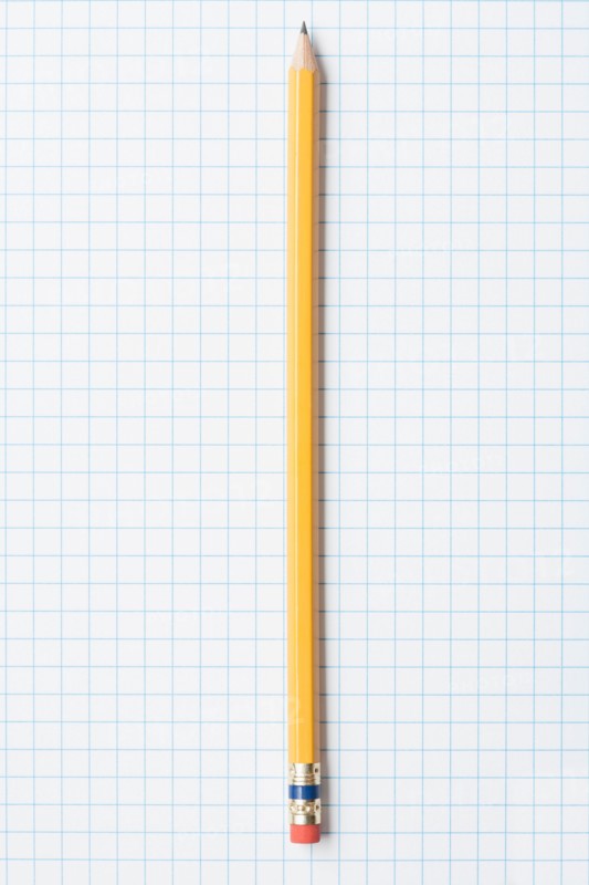 Single yellow sharpened pencil on graph paper. Photo: Kristin Duvall