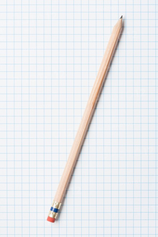 Single wooden sharpened pencil on graph paper. Photo : Kristin Duvall