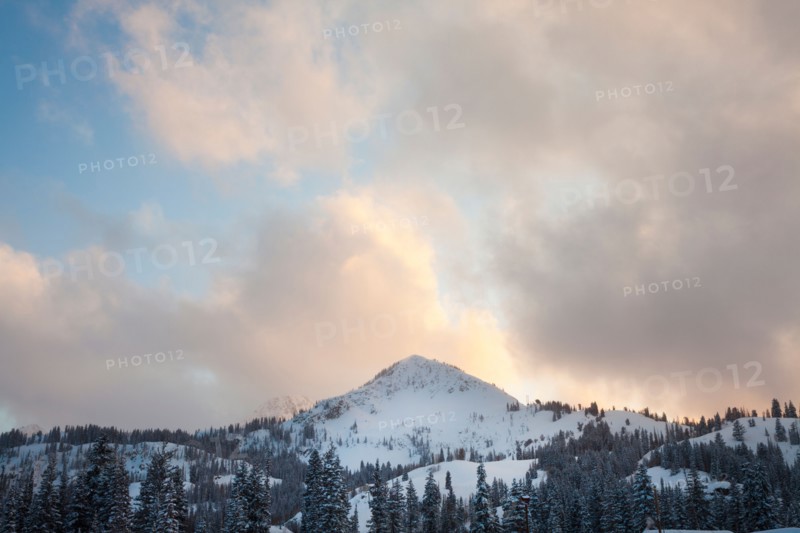 Snow covered mountain peak with late evening sky. Photo: Mike Kemp