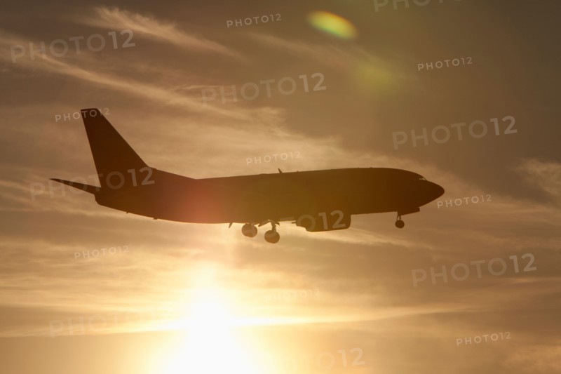 Silhouette of commercial jet flying. Photo: Mike Kemp