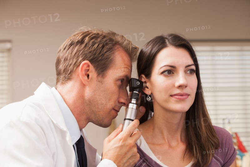 Doctor performing hearing test with Otoscope. Photo: Mike Kemp