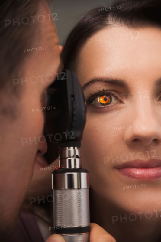 Close up of woman's eye lit up from doctor doing eye test. Photo: Mike Kemp