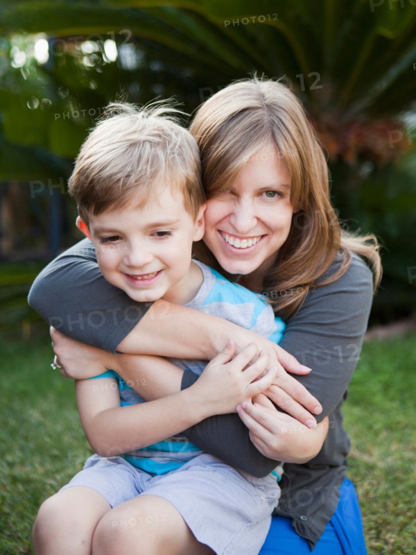 Laughing mother hugging her son. Photo : Jessica Peterson