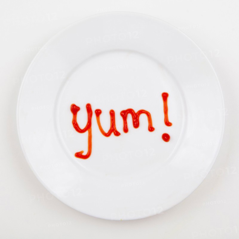 Word YUM written with ketchup. Photo: Jessica Peterson