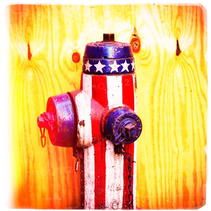 Fire hydrant with American flag pattern.