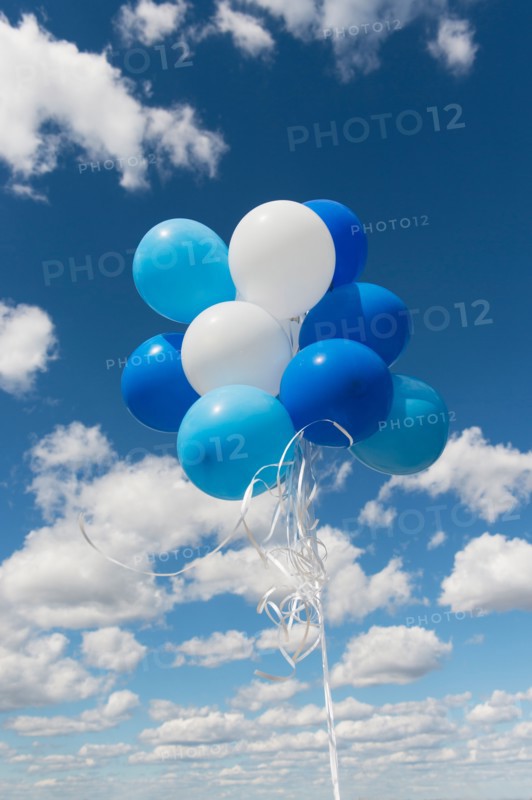 Bunch of balloons in sky.