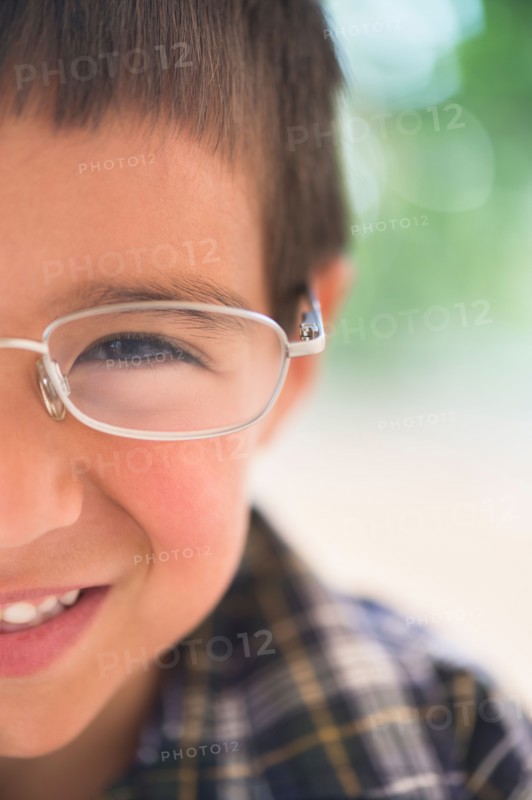 Portrait of boy (6-7) wearing glasses.