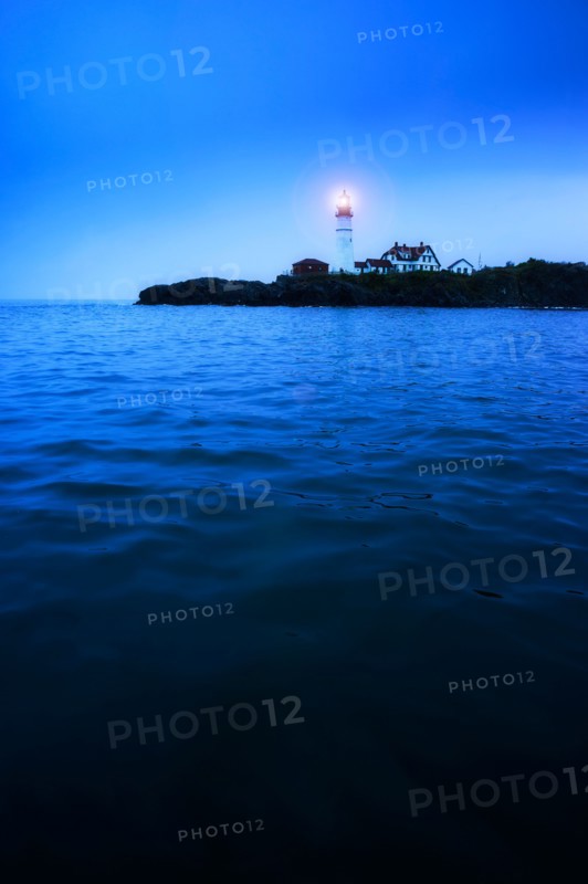 Remote coastline with lighthouse. Portland, Maine.