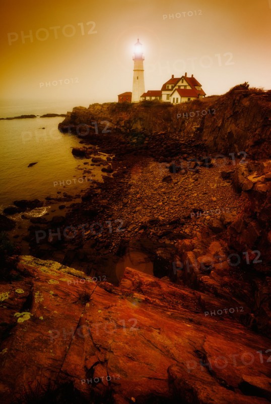 Remote coastline with lighthouse. Portland, Maine.
