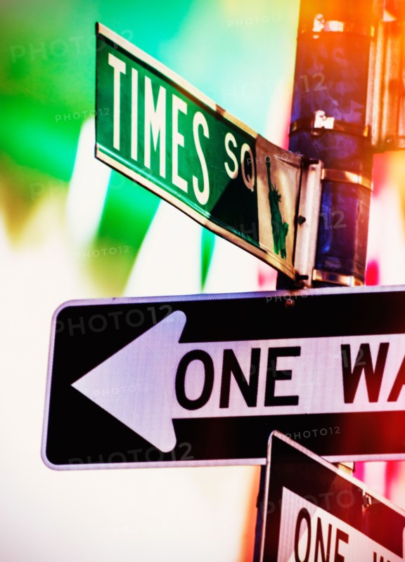 Directional signs at night. New York City, New York.