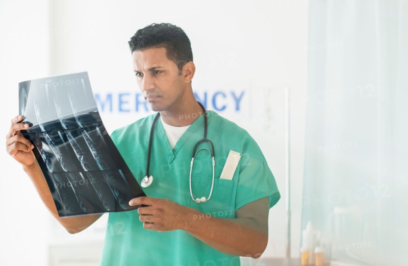 Doctor looking at x-ray image.