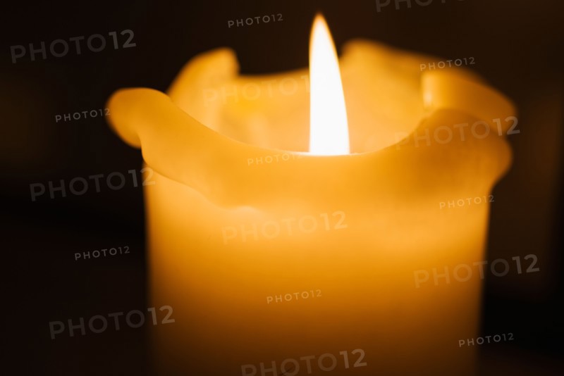 Studio shot of burning candle.