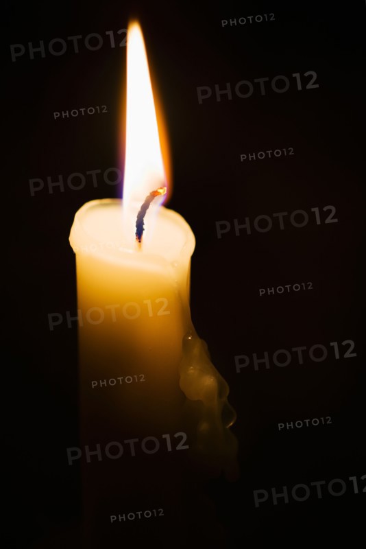 Studio shot of burning candle.