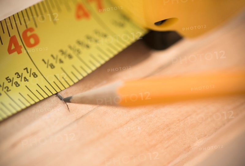 Close-up of tape measure and pencil