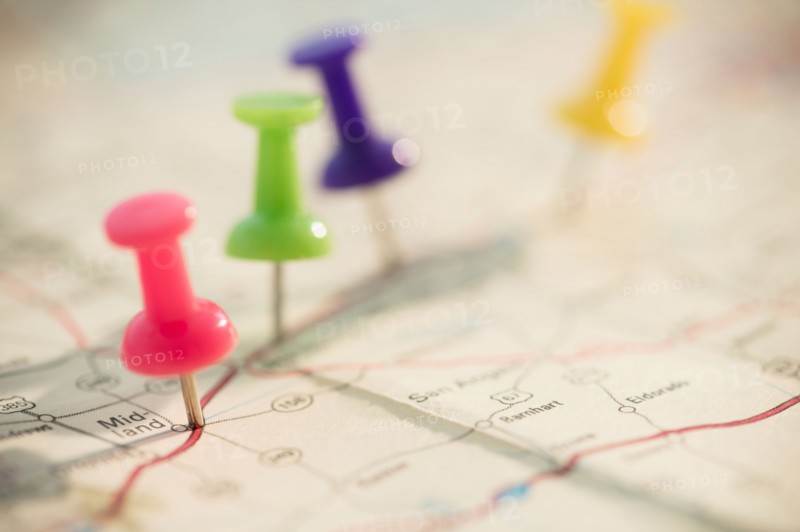 Thumbtacks on map