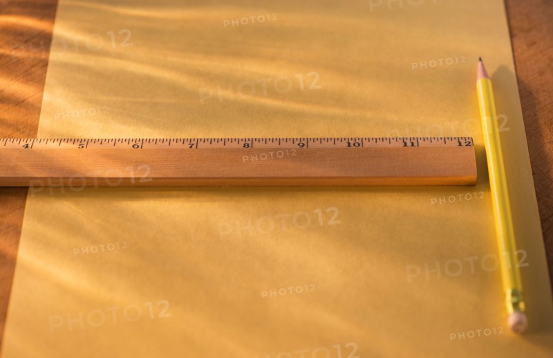 Elevated view of ruler, pencil and paper sheet