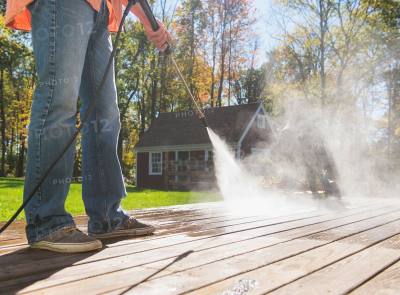 Man cleaning porch