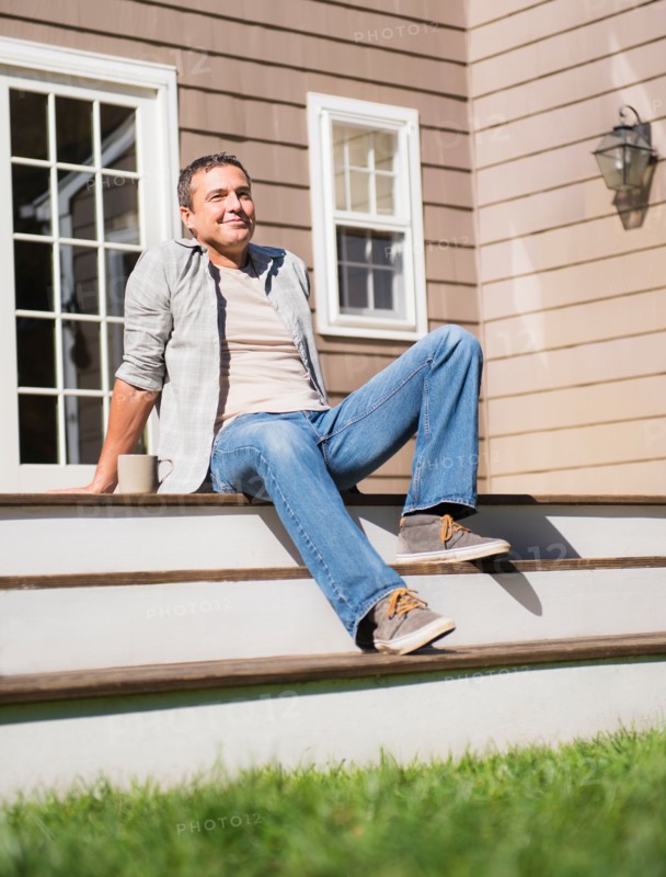 Portrait of man relaxing on steps