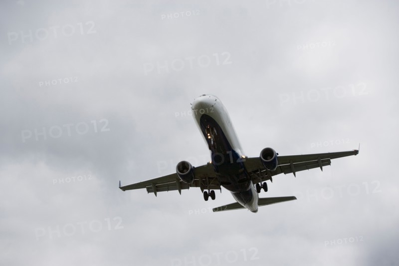 Low angle view of flying airplane