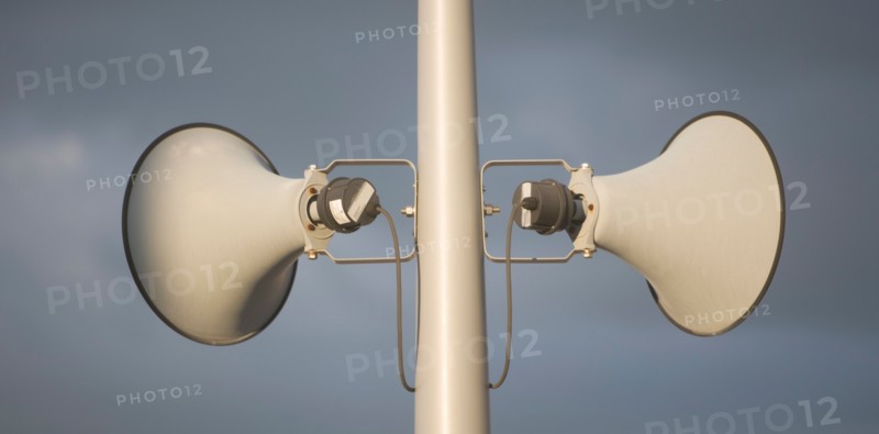 Megaphone against grey sky