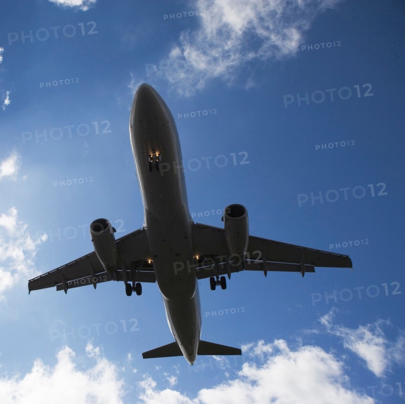 Low angle view of flying airplane