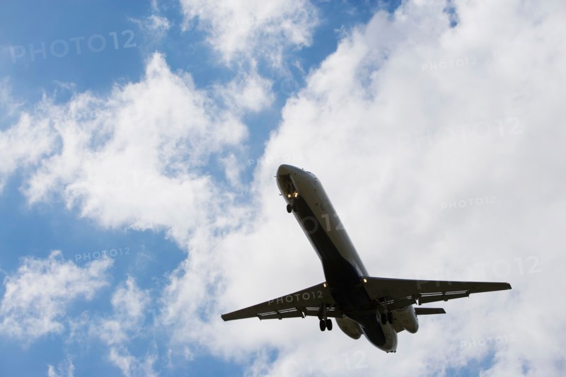 Low angle view of flying airplane