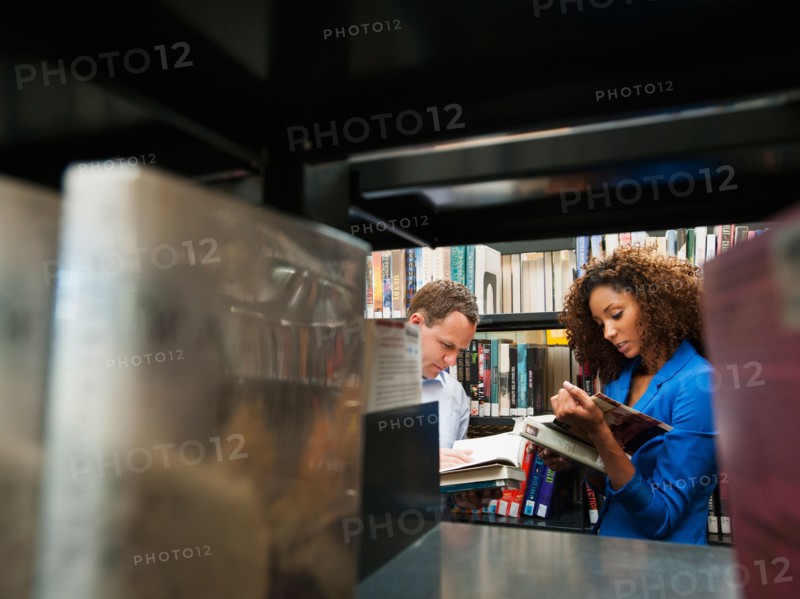 Man and woman researching library