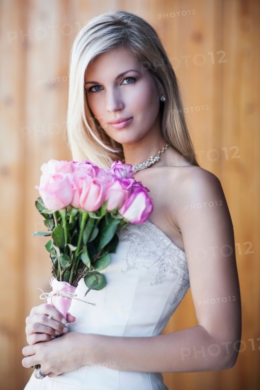 Portrait of bride holding bouquet