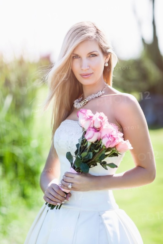 Portrait of bride holding bouquet