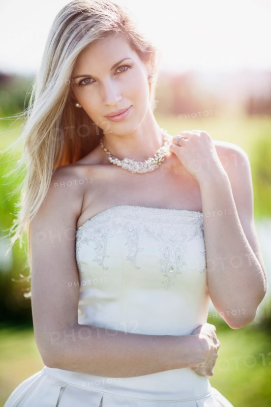 Portrait of bride posing outdoors