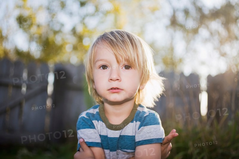 Toddler boy with arms crossed
