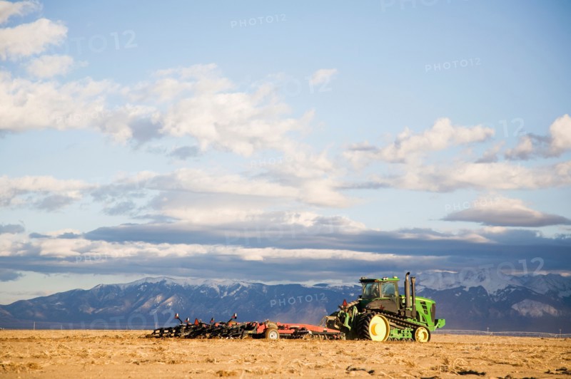Tractor tilling field