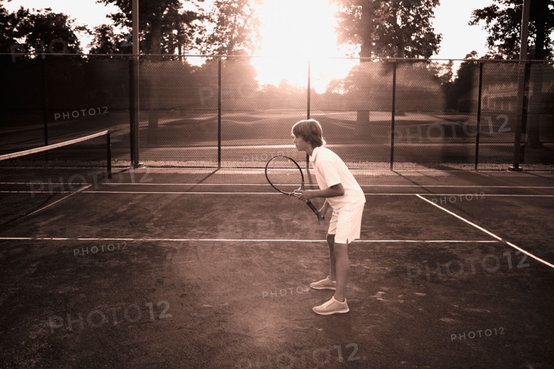 Boy playing tennis