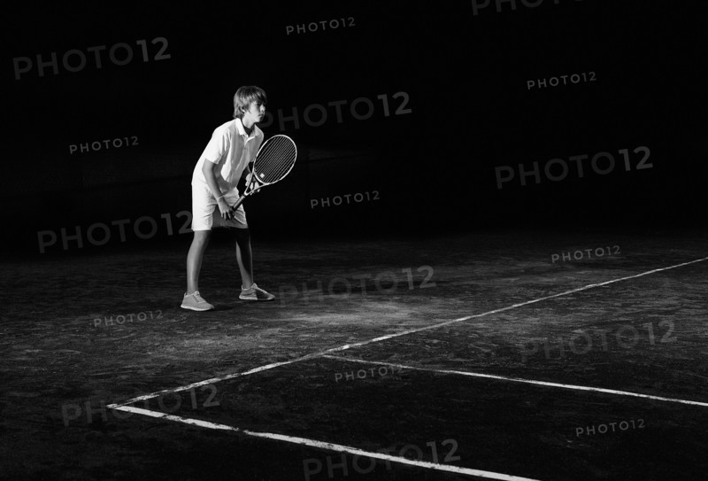 Boy playing tennis