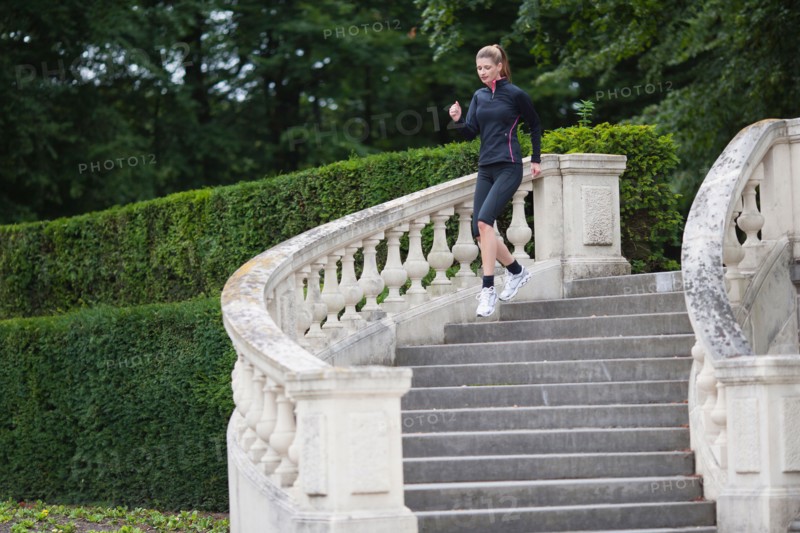 Young woman running down stairs