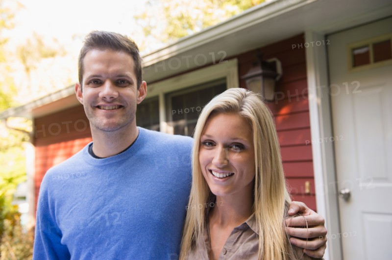 Couple in front of cottage. Photo: Jamie Grill