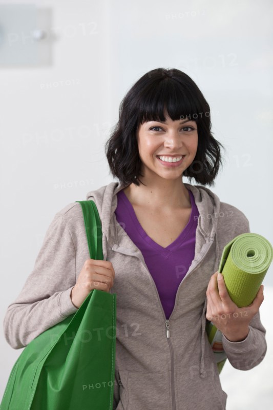 Portrait of young woman going for fitness. Photo : Dan Bannister