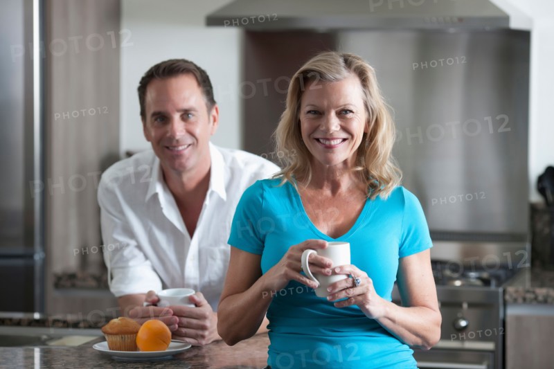 Mature couple drinking coffee. Photo: Dan Bannister