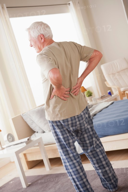 Senior man having backpain. Photo: Rob Lewine