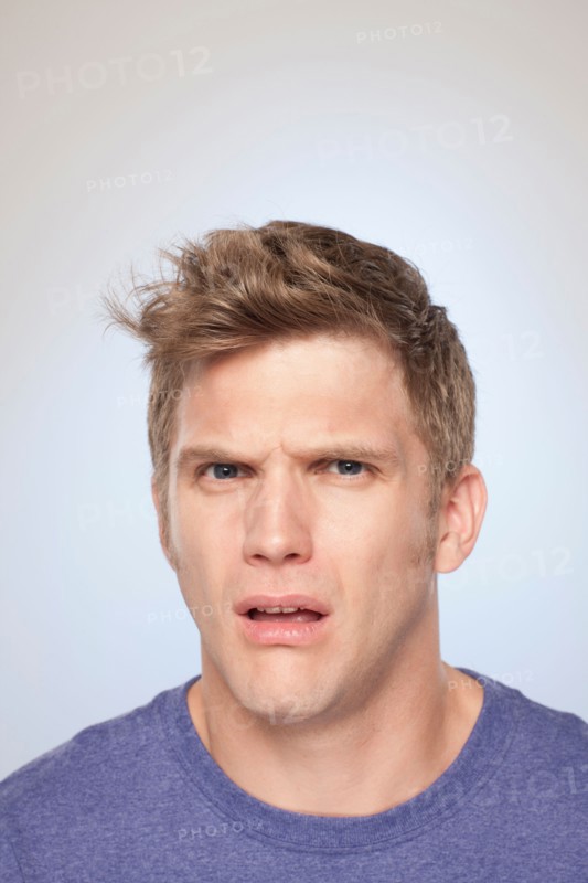 Portrait of displeased man. Photo: Rob Lewine