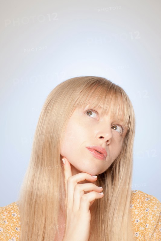 Portrait of woman day dreaming. Photo : Rob Lewine