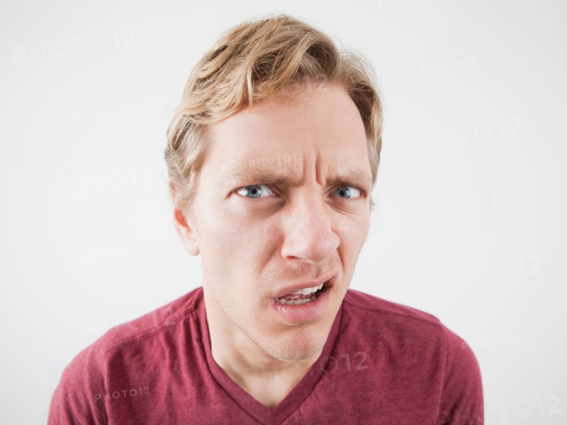 Studio Shot of mid adult man expressing anger. Photo: Jessica Peterson