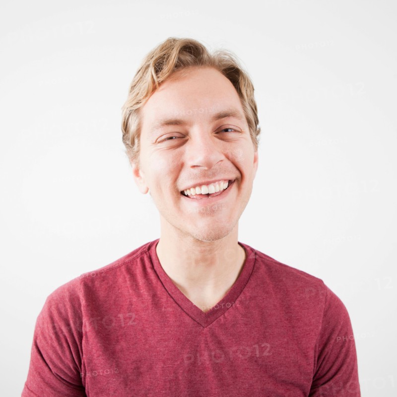 Studio Shot of mid adult man expressing happiness. Photo: Jessica Peterson